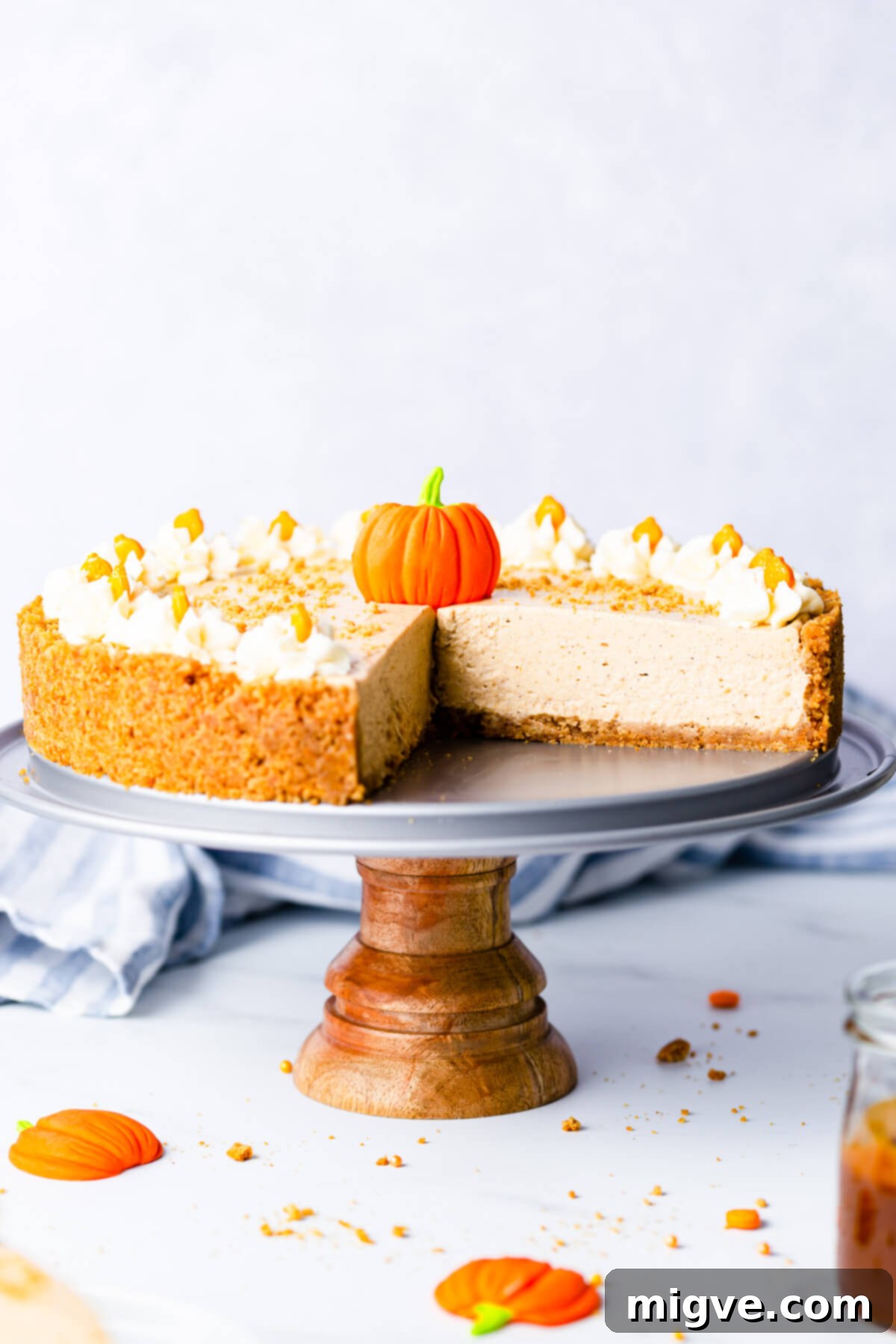 straight ahead close up at no bake pumpkin cheesecake on a small cake stand
