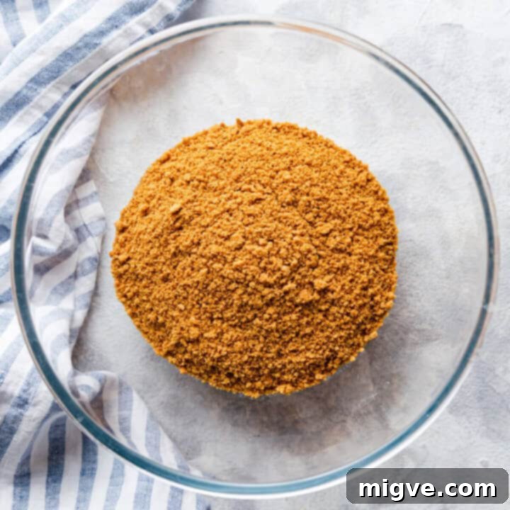 overhead view of a glass bowl with biscuits crumbs