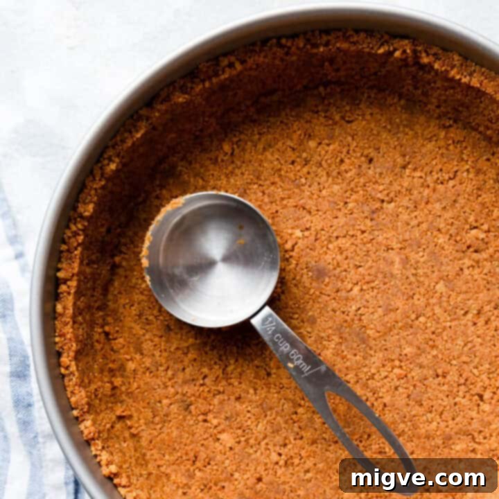 top view close up of a round baking pan with biscuit crust inside