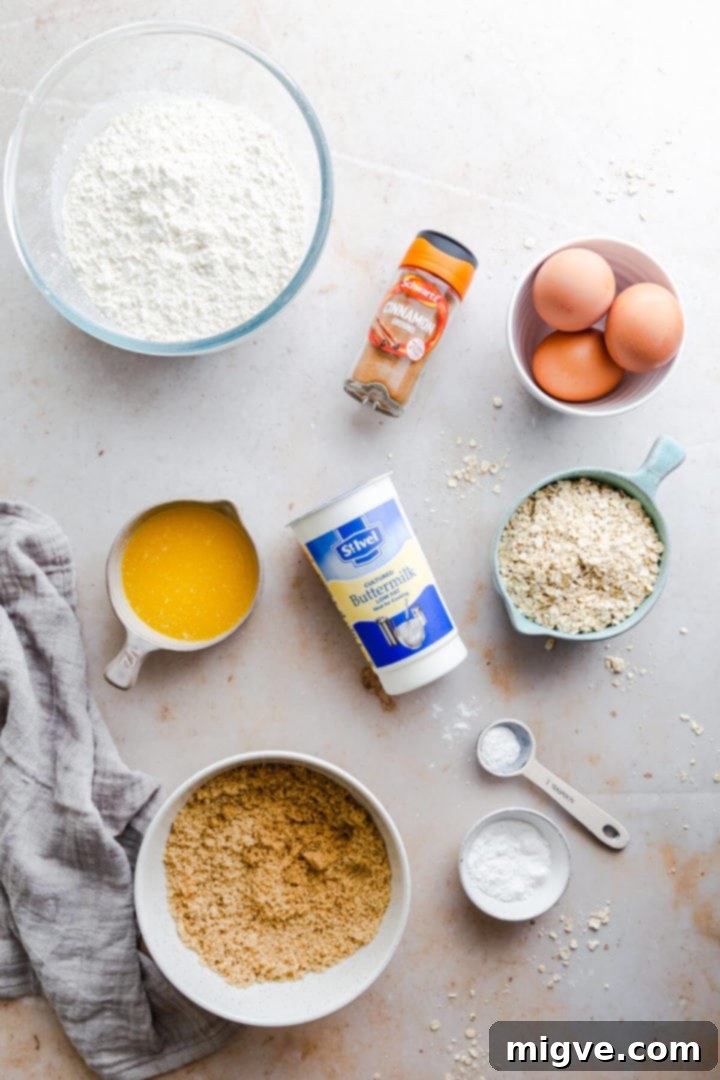Top-down view of all the ingredients laid out for making cinnamon oatmeal muffins