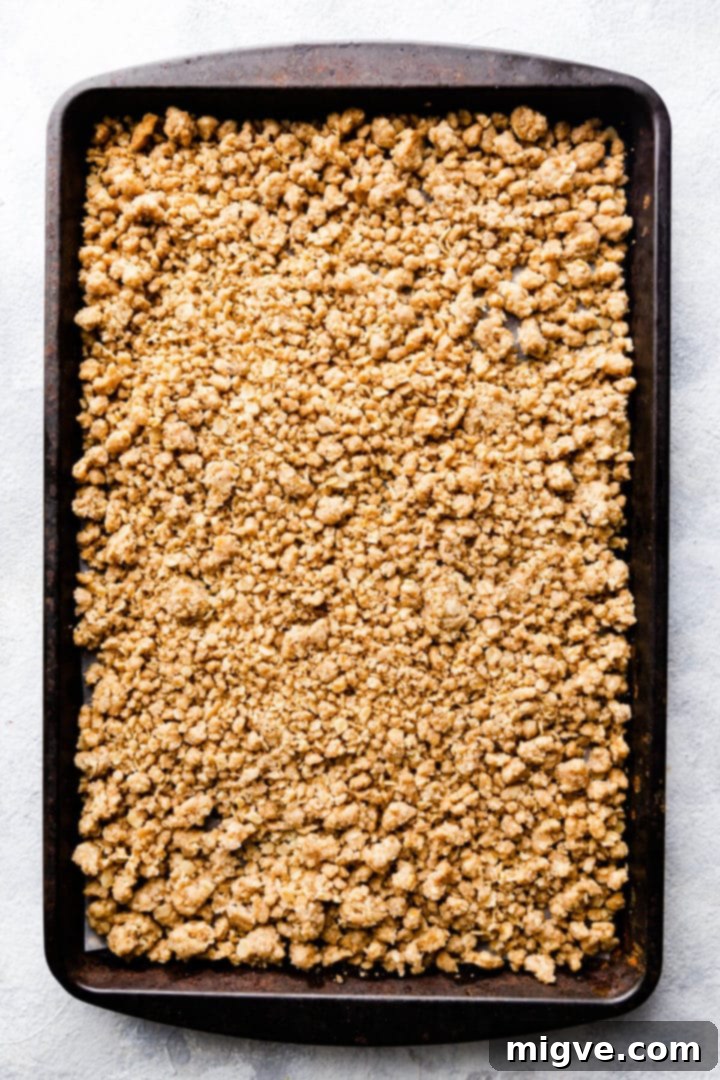 Spiced Apple Crumble Cupcakes 14 overhead shot of baked crumble topping on a baking tray