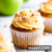 Spiced Apple Crumble Cupcakes 24 straight ahead super close up at a single apple crumble cupcake