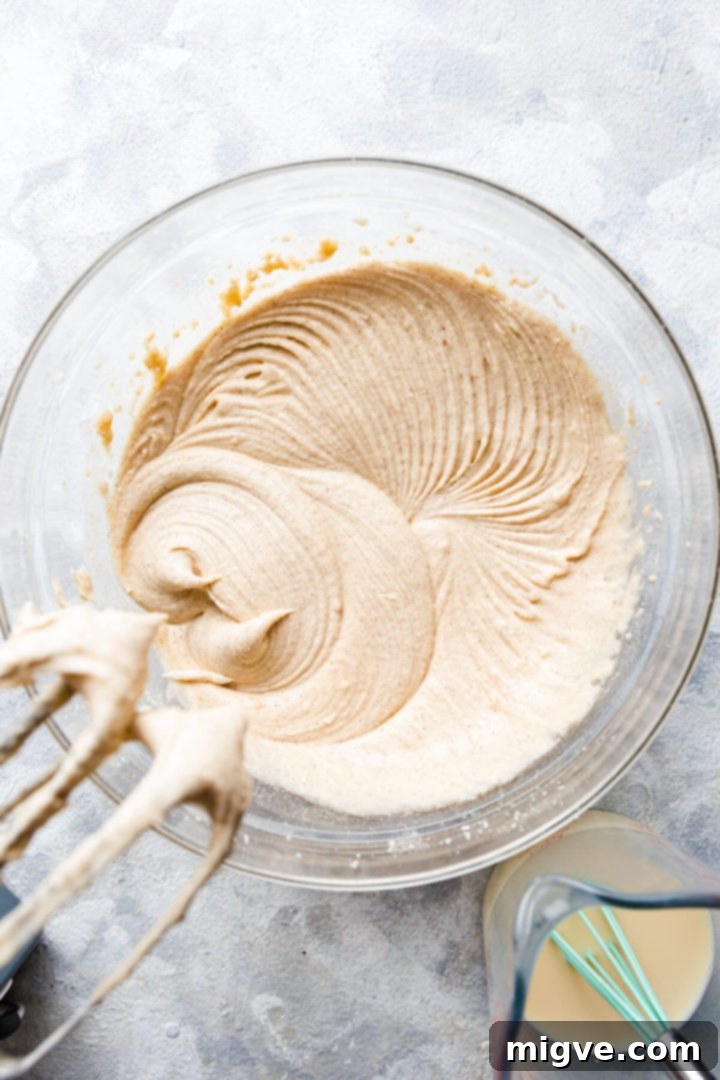 Spiced Apple Crumble Cupcakes 10 top view of cupcake batter coming together in a bowl