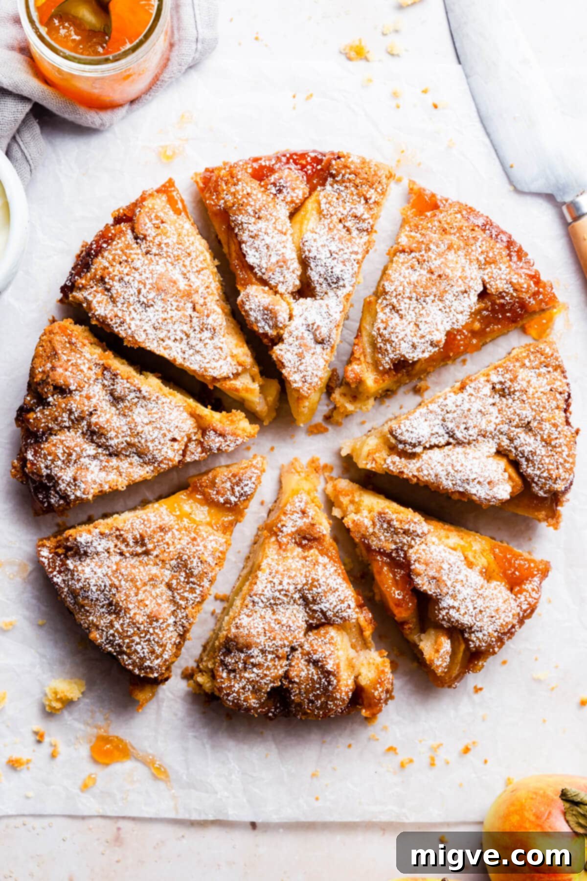 No-Fuss Apple Cake 2 overhead close up at easy apple cake cut into eight individual slices, showcasing its moist texture and apple layers