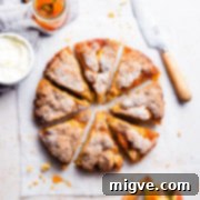 No-Fuss Apple Cake 14 top view of a round apple cake cut into eight slices, showing its delicious texture