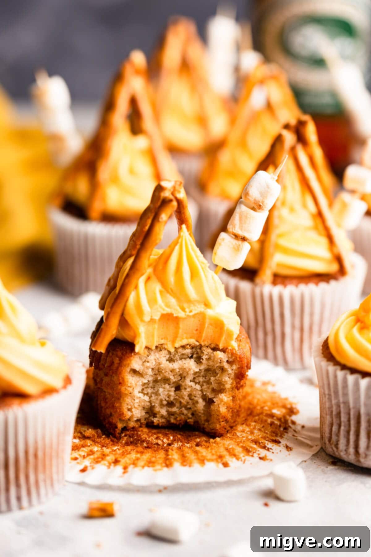 Flame-Kissed Cupcakes 10 side close up at bonfire cupcake with a bite taken out of it