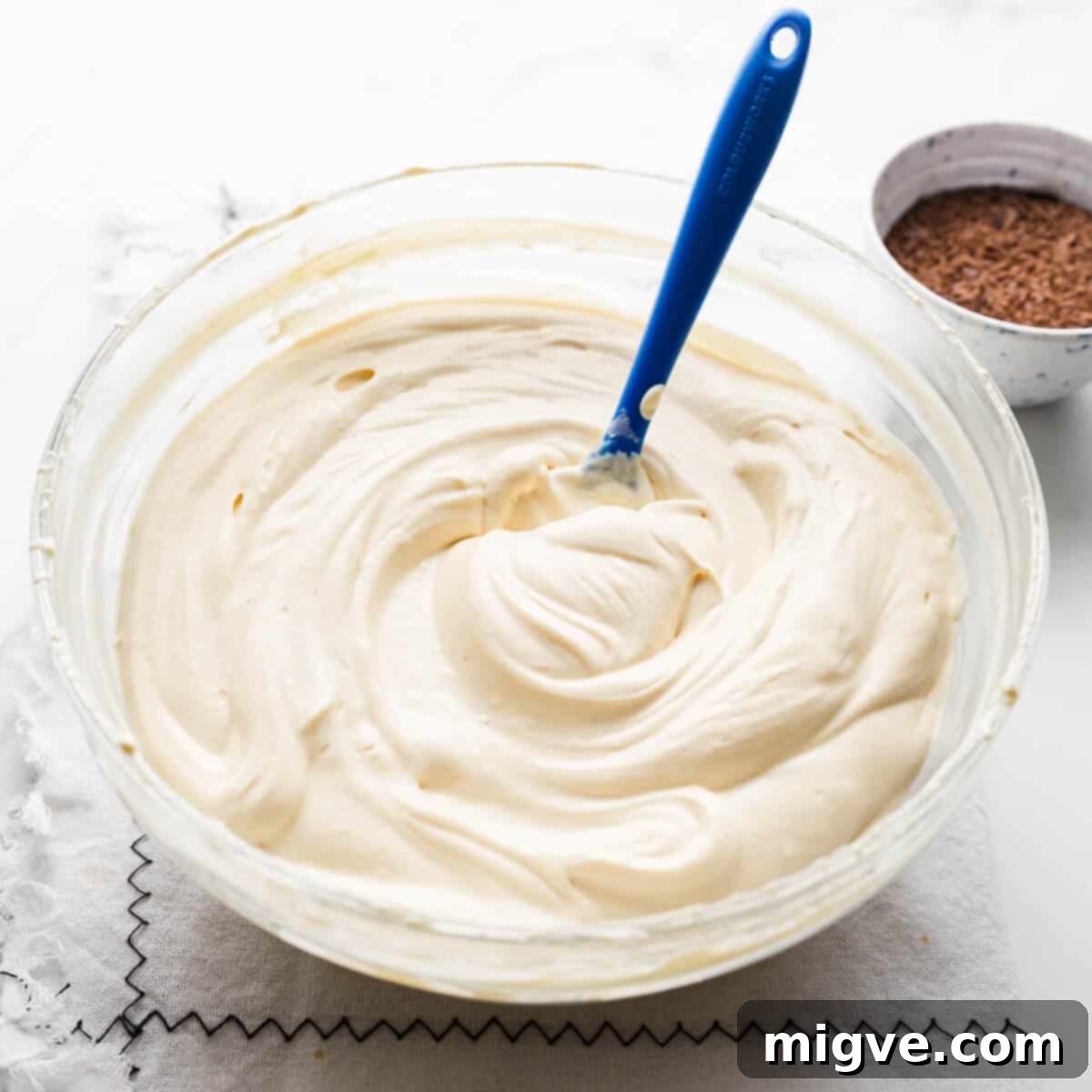 bowl with creamy filling for the baileys cheesecake.