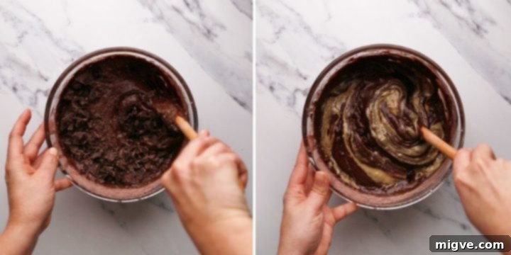 overhead view of brownie batter being mixed with chopped chocolate and tahini paste