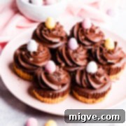 45 degree angle view at a plate filled with chocolate mini cheesecakes topped with mini eggs