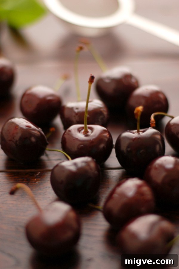 Assortment of toast slices topped with delicious homemade Cherry Jam with Cinnamon, perfect for breakfast or brunch.