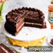 45 degree angle view at a chocolate cake on a cake stand