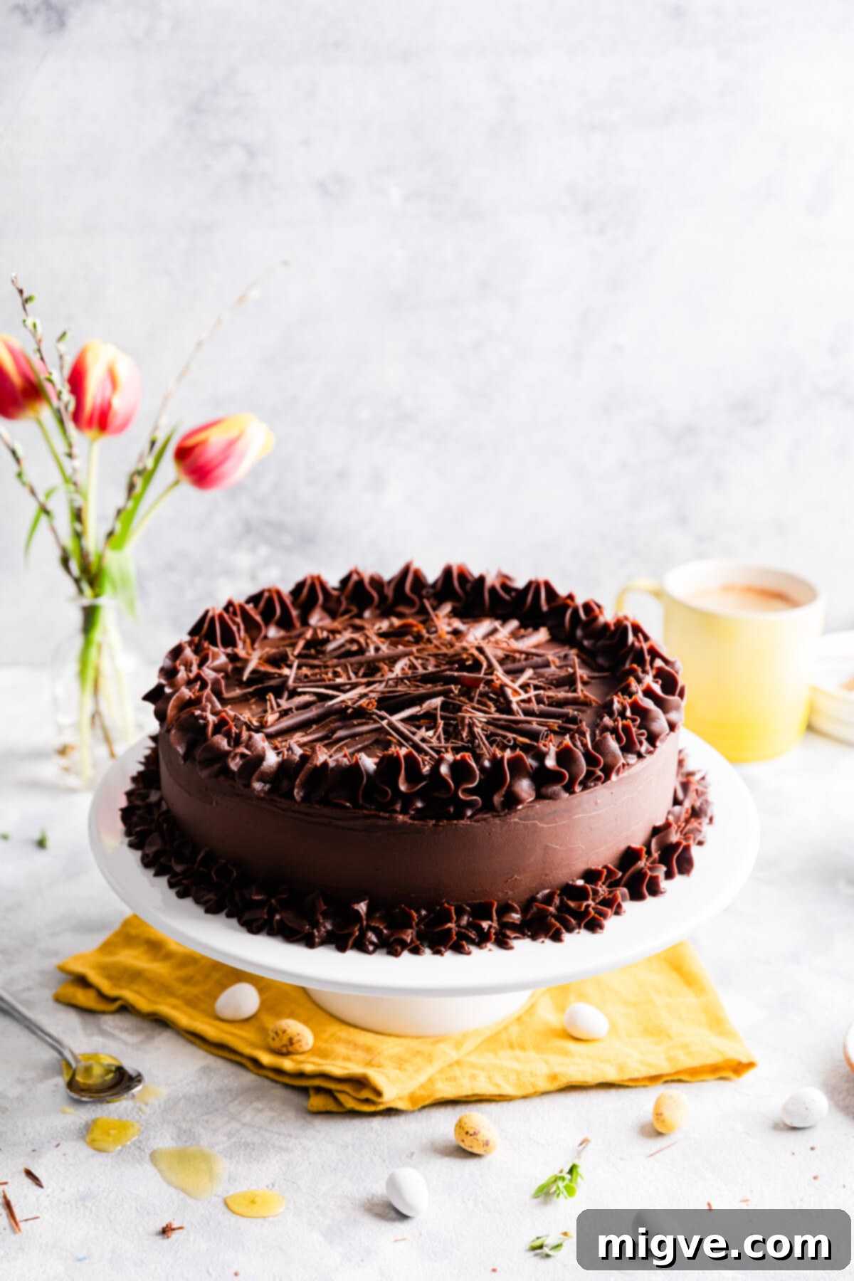 chocolate cake on a white cake stand