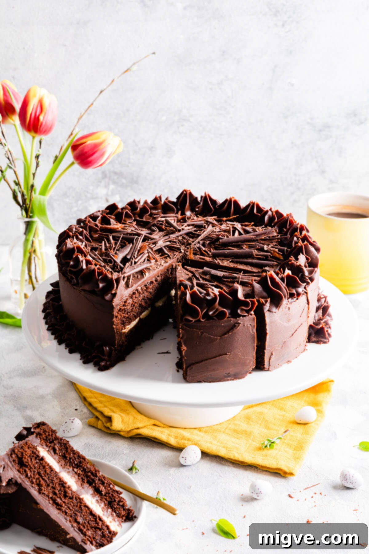 close up of a one bowl chocolate cake with slice cut out