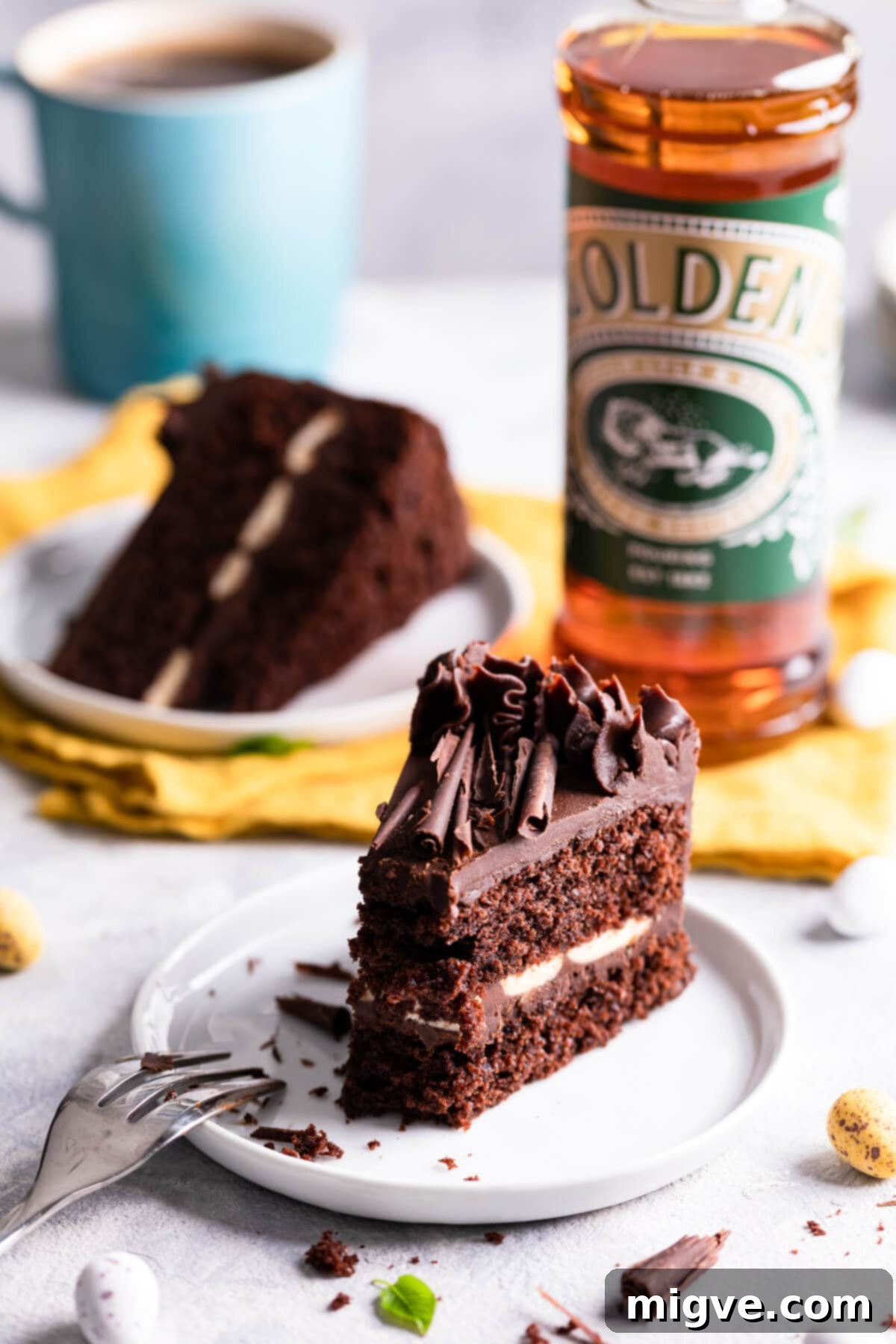 side close up at a slice of chocolate cake with bite taken out