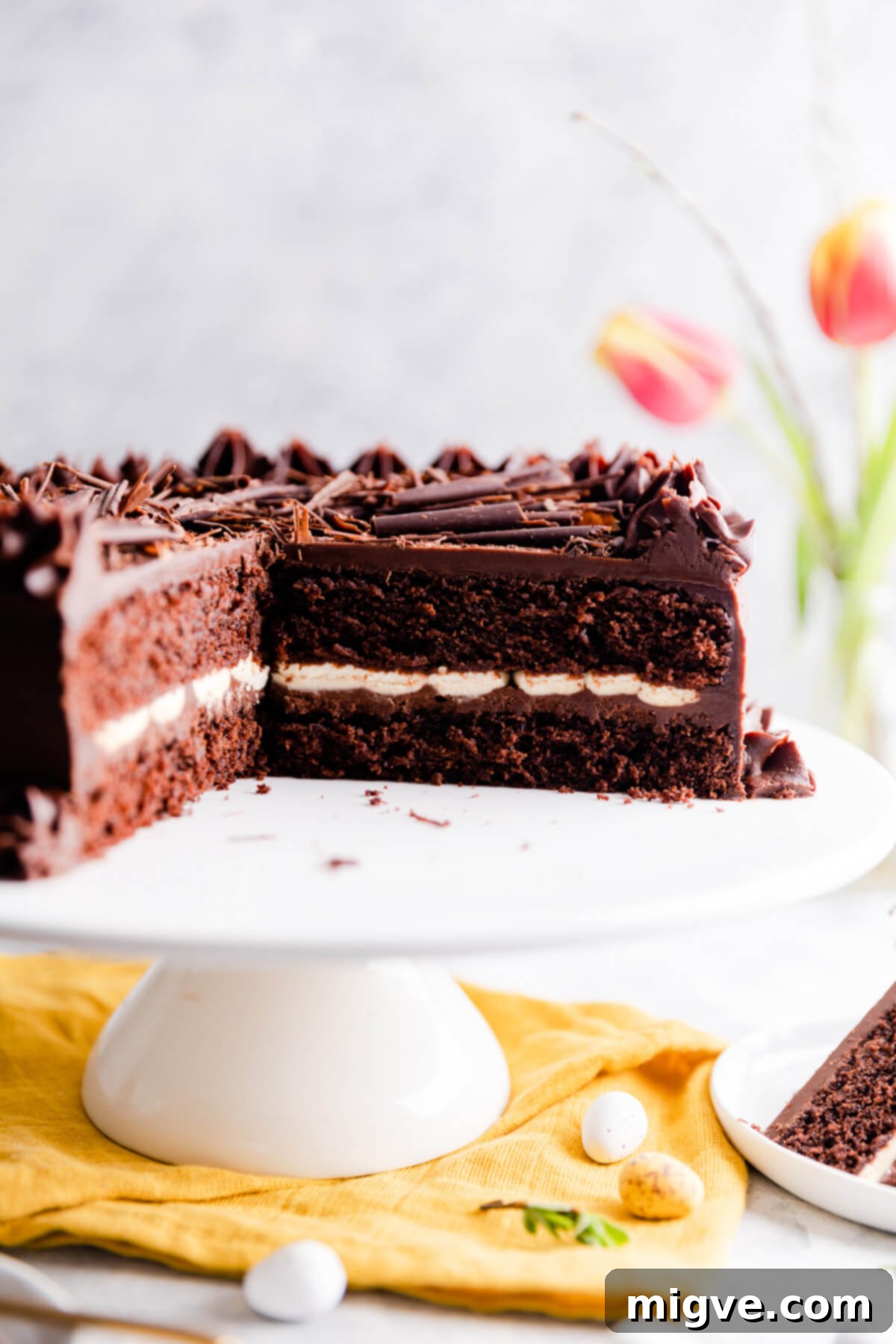 super close up at a chocolate cake with cream filling