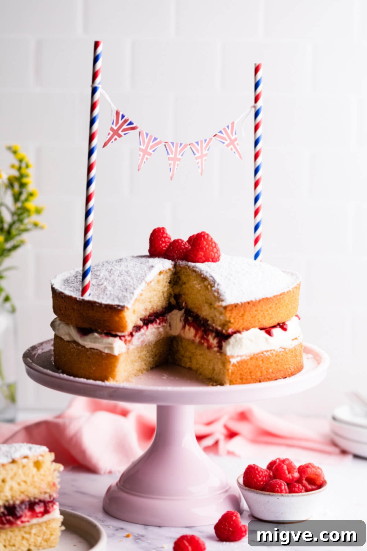 Classic Victoria Sponge 14 straight ahead photo of Victoria sponge cake with slice cut out