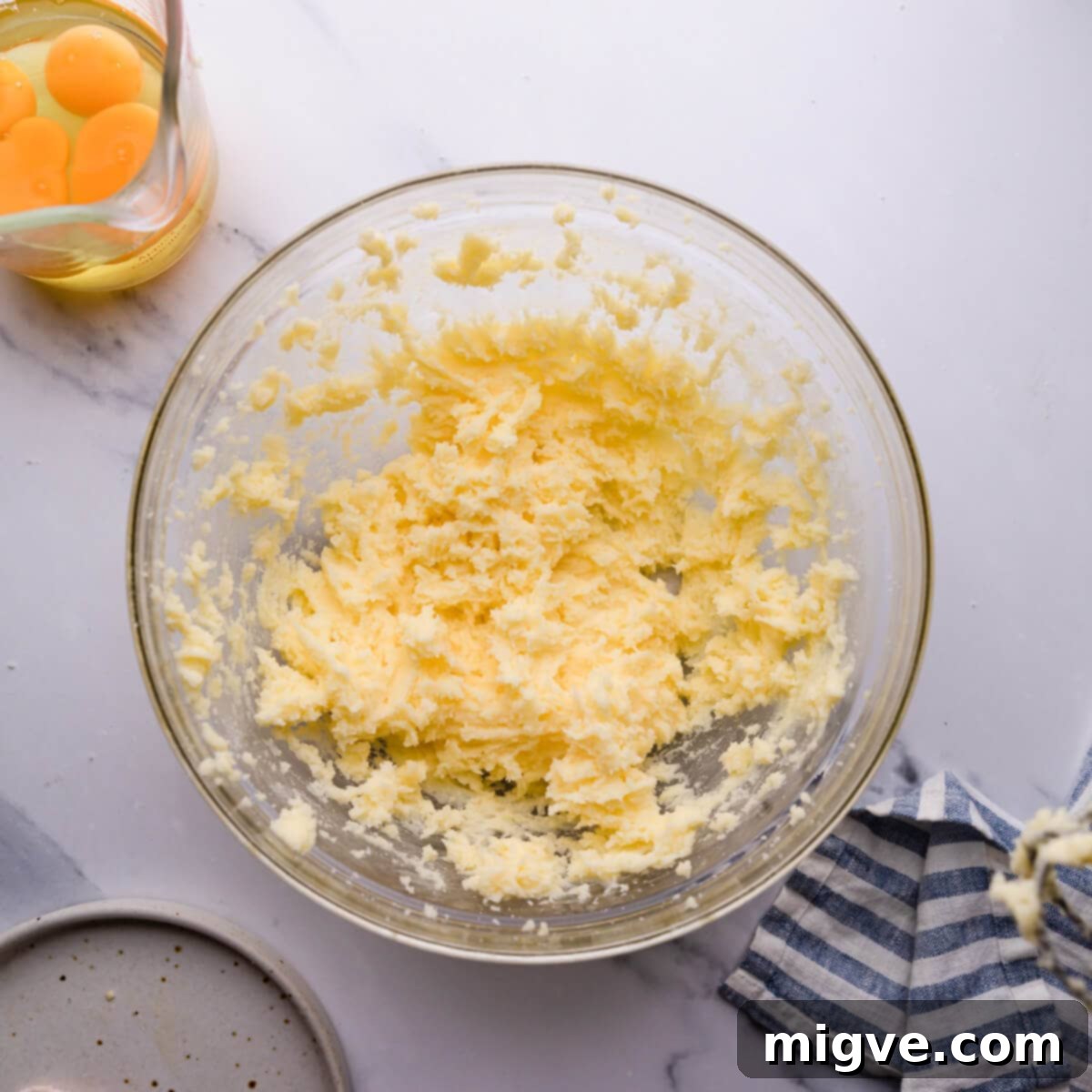 Classic Victoria Sponge 4 top view at a bowl with butter and sugar mixture