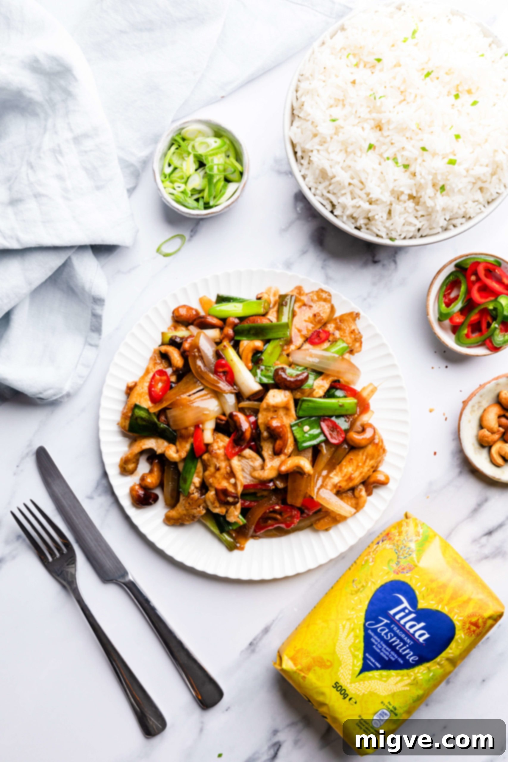 Crunchy Cashew Thai Chicken 13 overhead view of cashew chicken and some side dishes around it