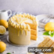 side close up at lemon and elderflower cake with slice cut out