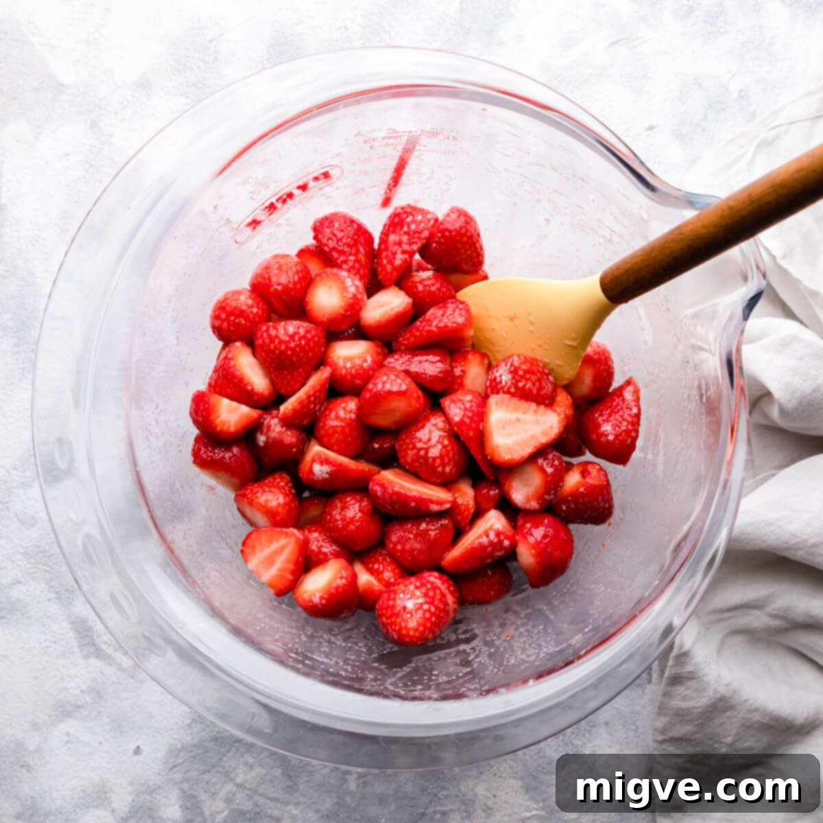 top down photo of strawberries in a glass bowl