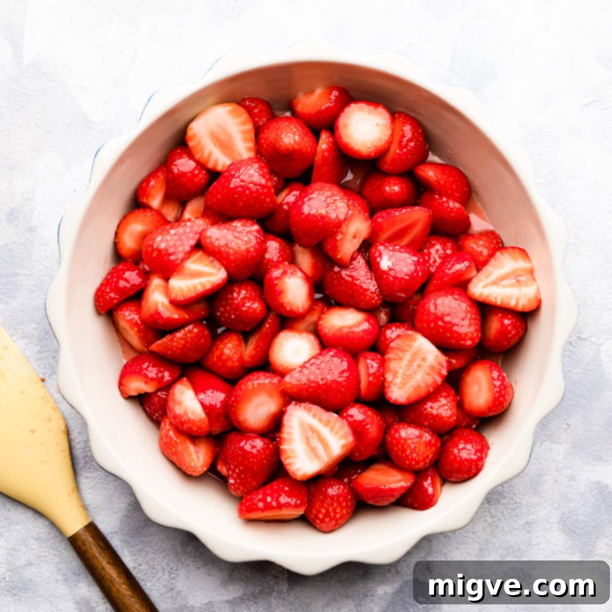overhead photo of strawberries in a pie dish