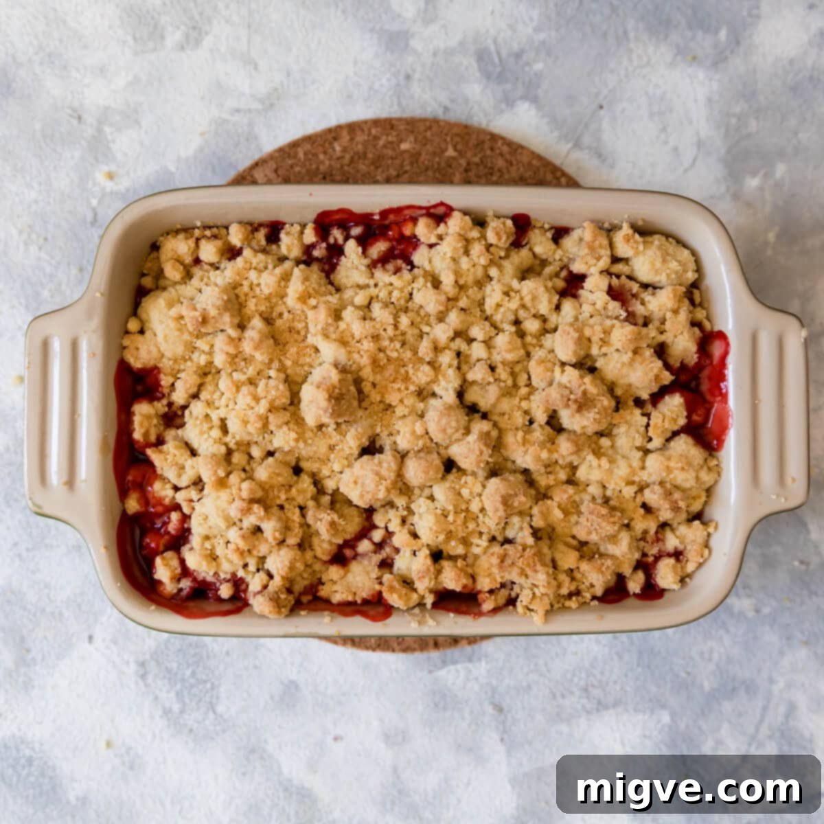 overhead view of a strawberry crumble made with melted butter