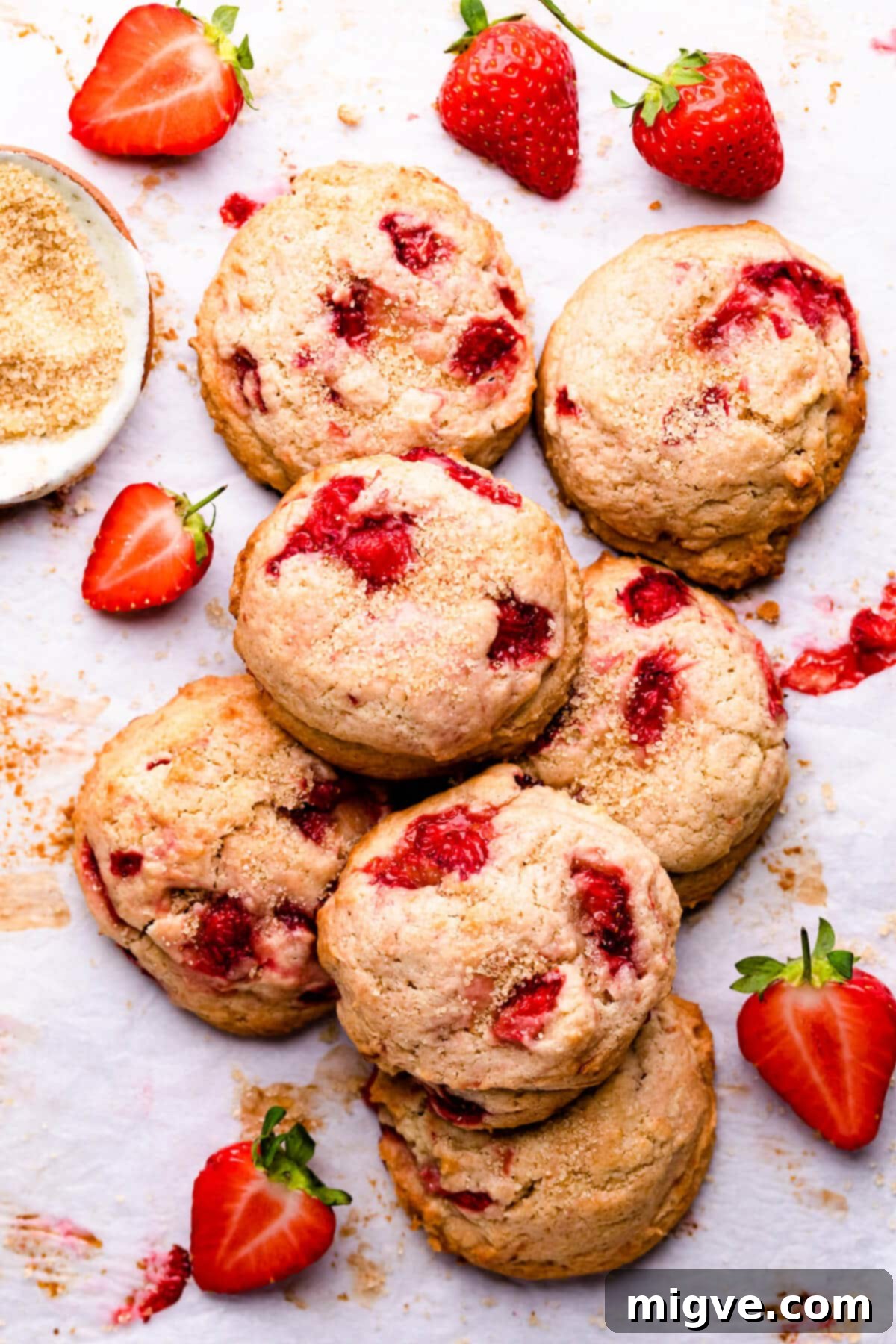 Shortcake Strawberry Cookies 11 Overhead view of freshly baked strawberry shortcake cookies lightly sprinkled with demerara sugar for added crunch and sparkle.