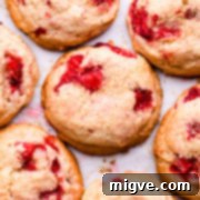 Shortcake Strawberry Cookies 14 Top down super close up at a shortcake cookie with strawberries and sprinkle of sugar