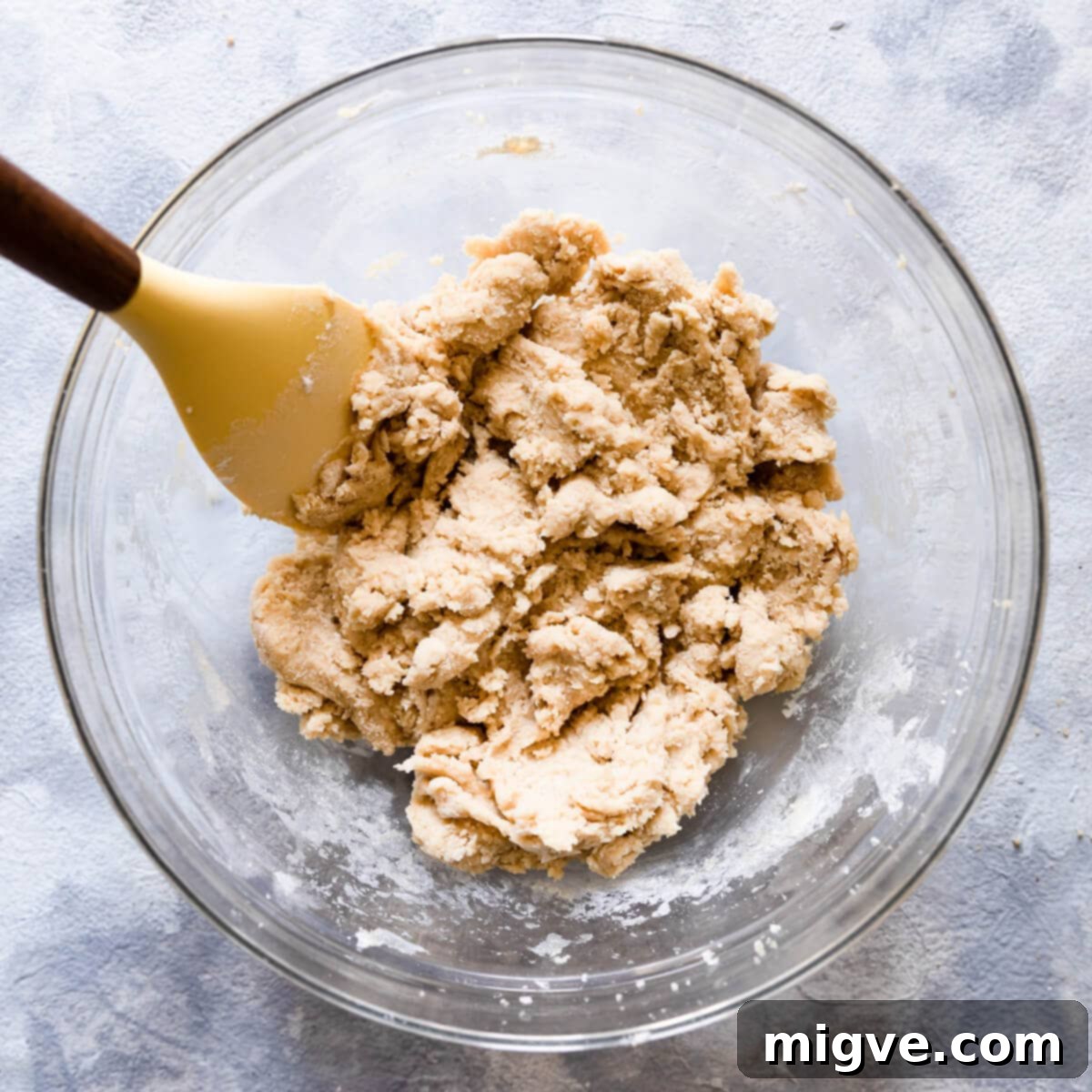 Shortcake Strawberry Cookies 6 A large mixing bowl filled with light-colored, slightly pink cookie dough, flecked with small pieces of strawberry.