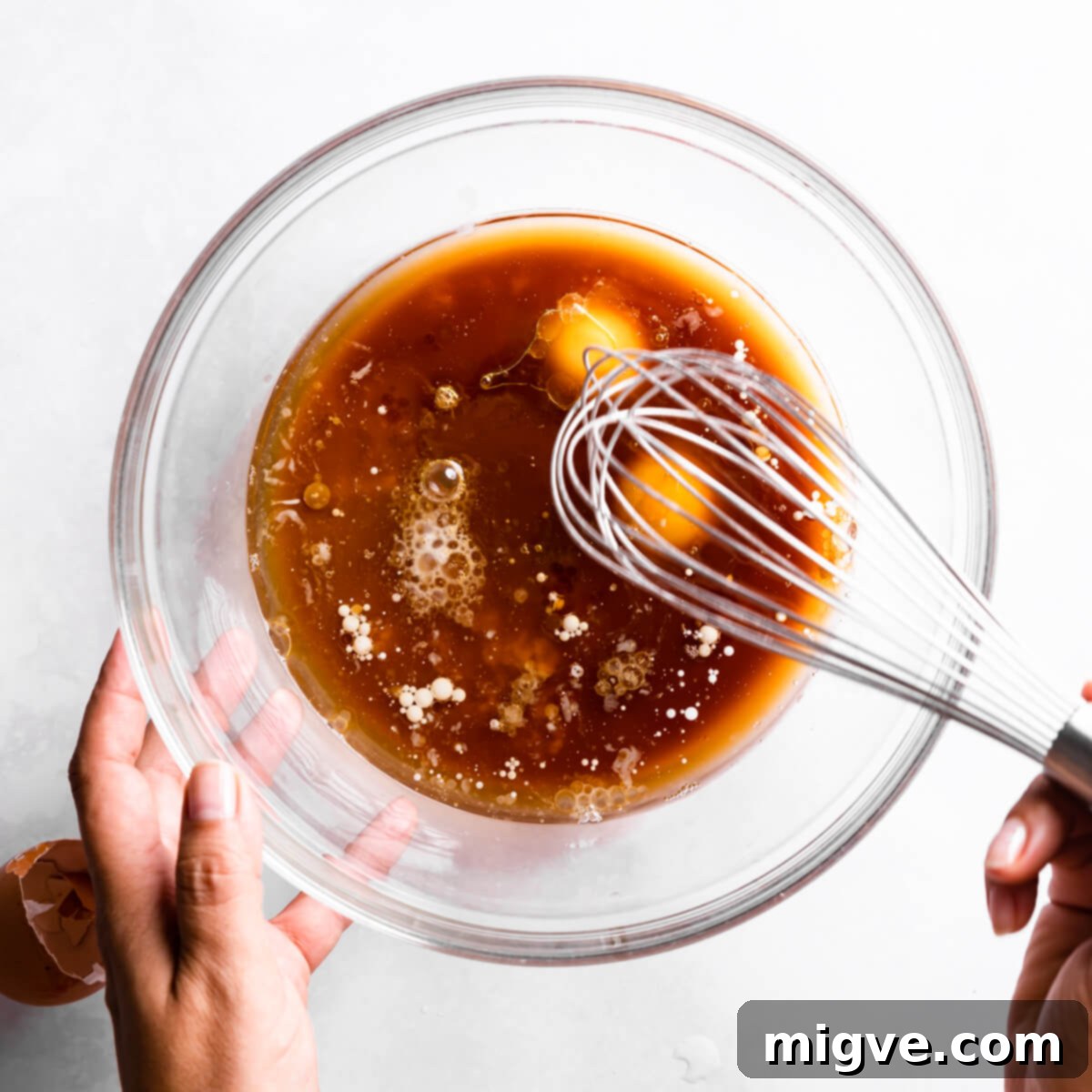 Bandaged Boo Cupcakes 5 Wet ingredients being vigorously whisked in a separate large bowl until fully combined and smooth.
