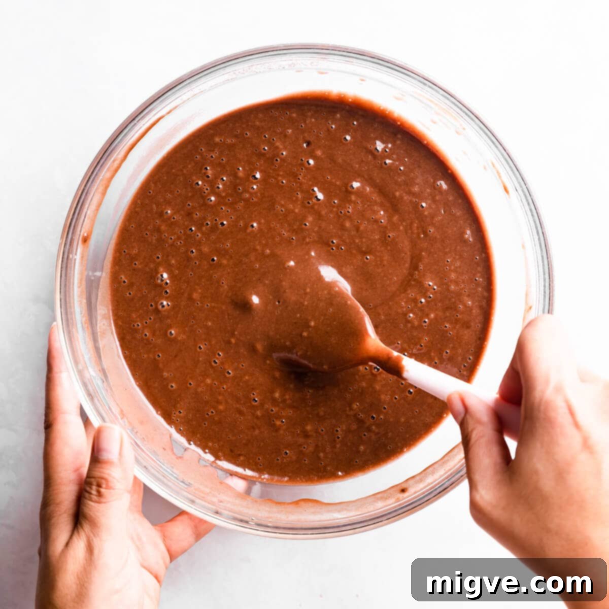 Bandaged Boo Cupcakes 6 Smooth, runny chocolate cupcake batter resting in a large glass bowl, ready for portioning.