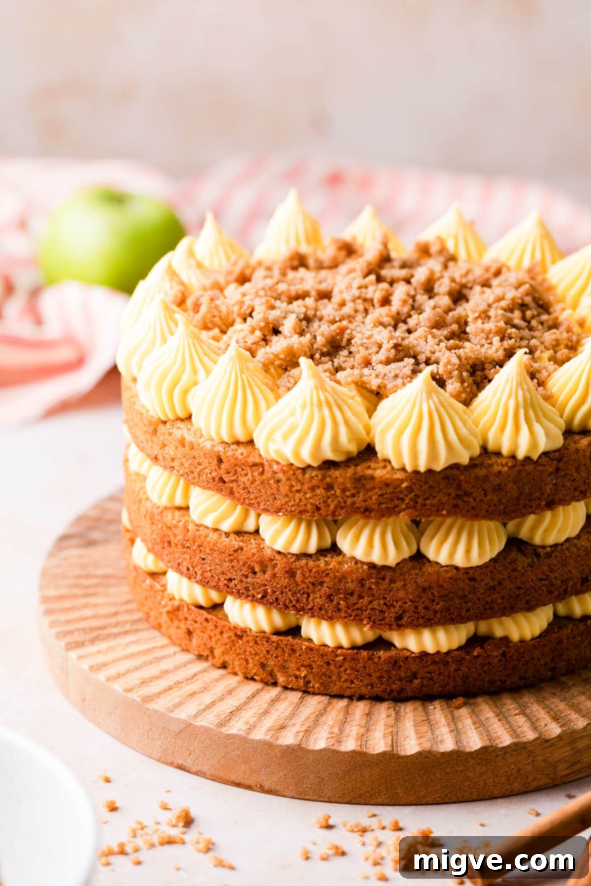 layer cake with apples and German buttercream and crumble topping.