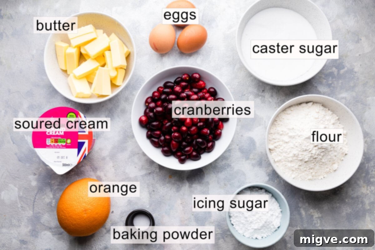 ingredients to make orange cranberry loaf cake with text labels