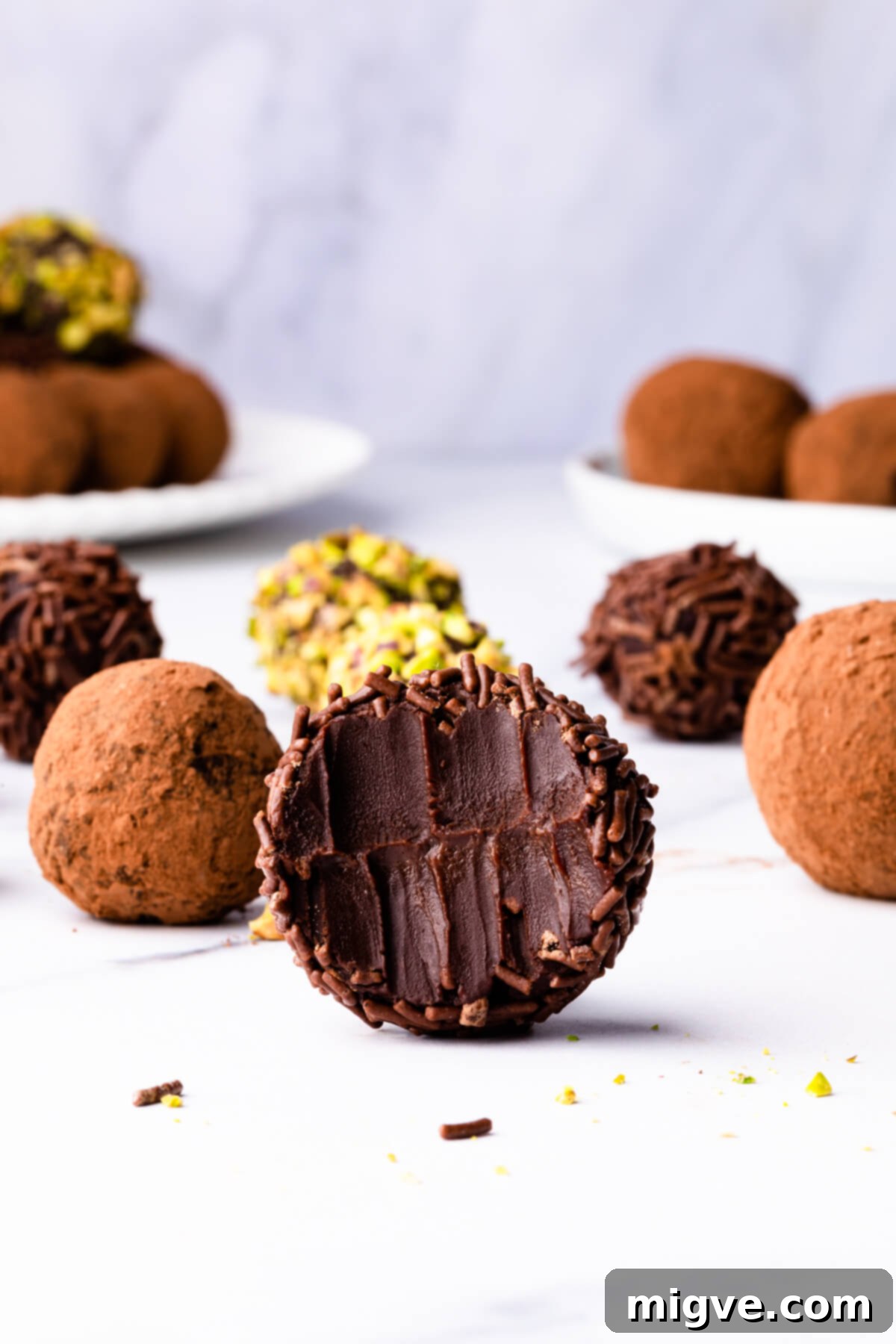 salted caramel truffle with bite taken out of it.