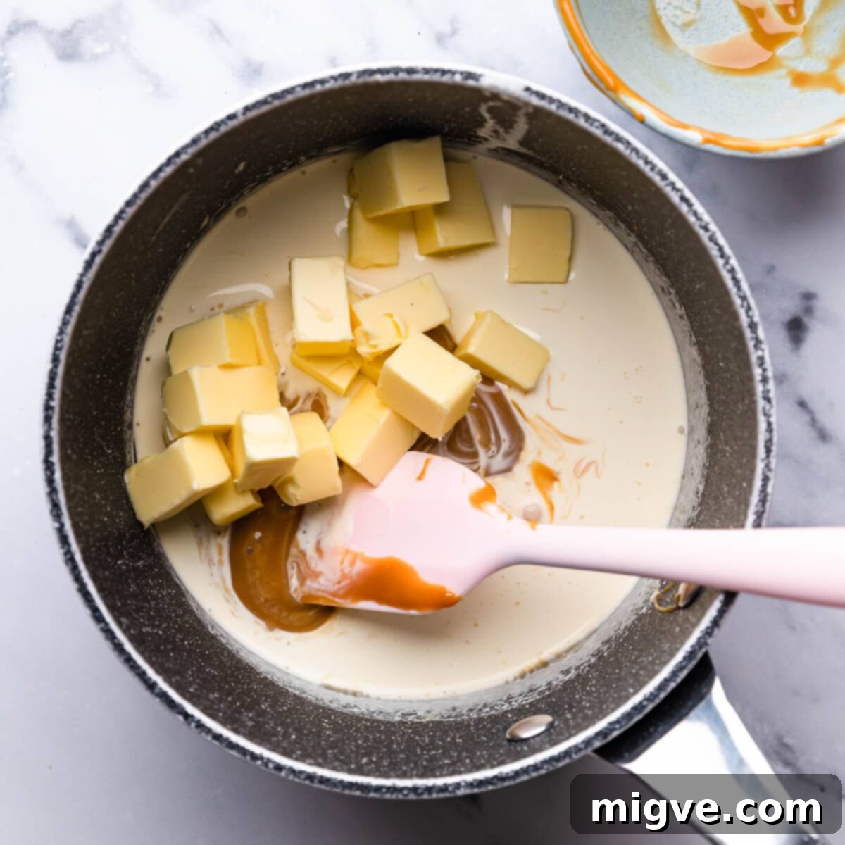 saucepan with cream, butter and caramel.