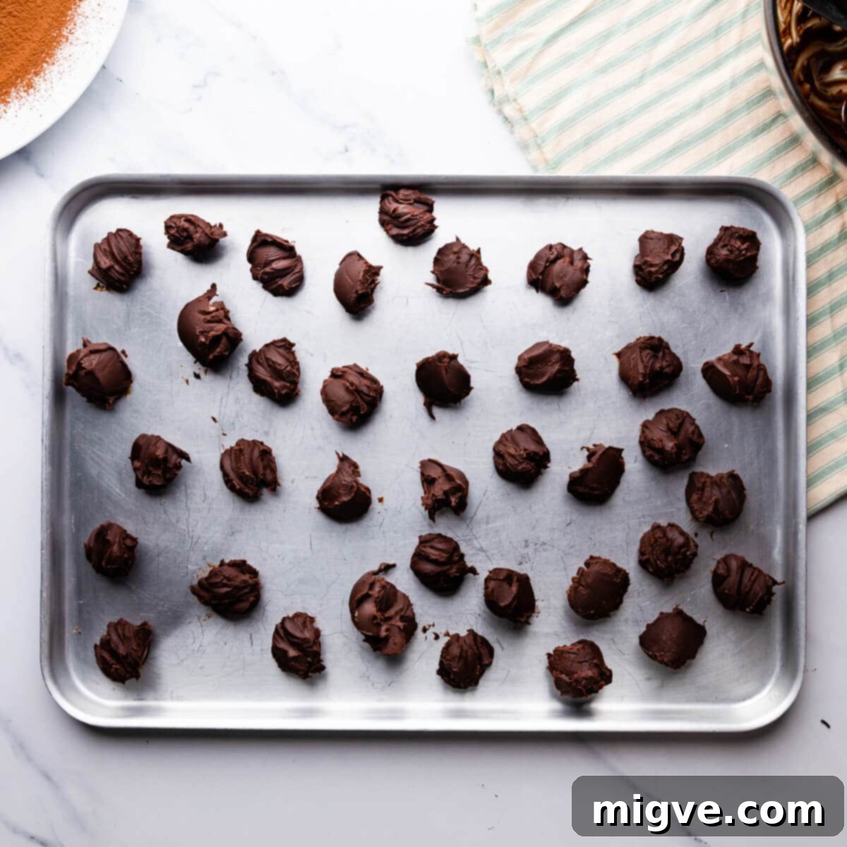 metal tray with small mounds of chocolate ganache.