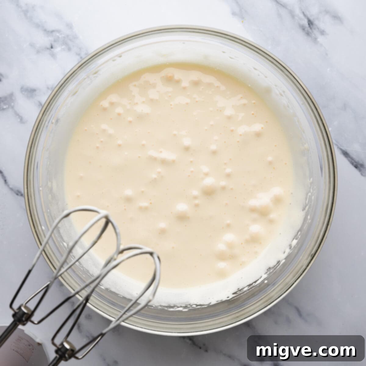 bowl with whipped eggs and sugar.
