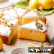 semolina cake with lemon cut into individual slices with lemons in the background.