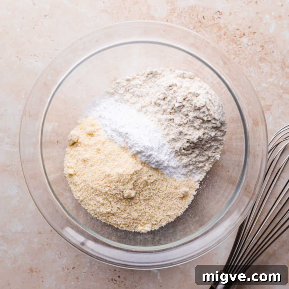 mixing bowl with ground almonds, icing sugar and flour.