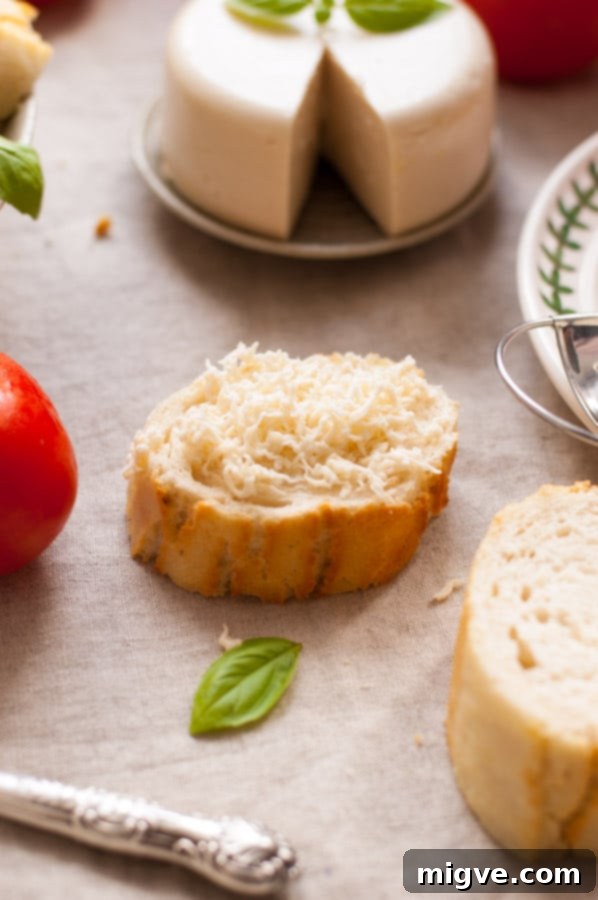 A block of homemade vegan mozzarella cheese, perfectly set and ready to be enjoyed. This easy-to-make plant-based cheese is a fantastic dairy-free option for various recipes.