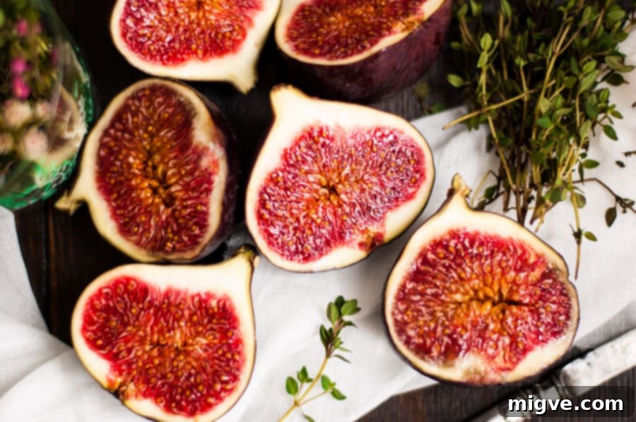 Juicy baked figs with thyme, crunchy toasted walnuts, and melted vegan mozzarella cheese. A perfect autumnal appetizer or light dessert. | via@ annabanana.co