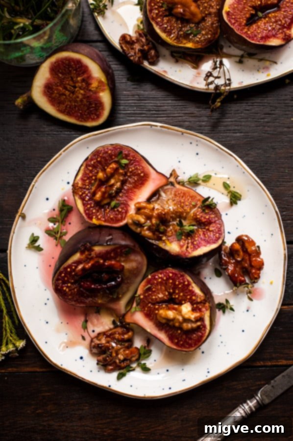 Close-up of baked figs with fragrant thyme and golden toasted walnuts. A rustic and elegant vegan appetizer. | via@ annabanana.co