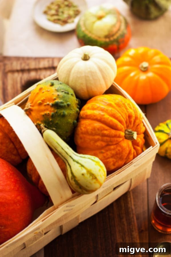 A beautifully presented roasted pumpkin soup, with a swirl of cream and fresh sage leaves