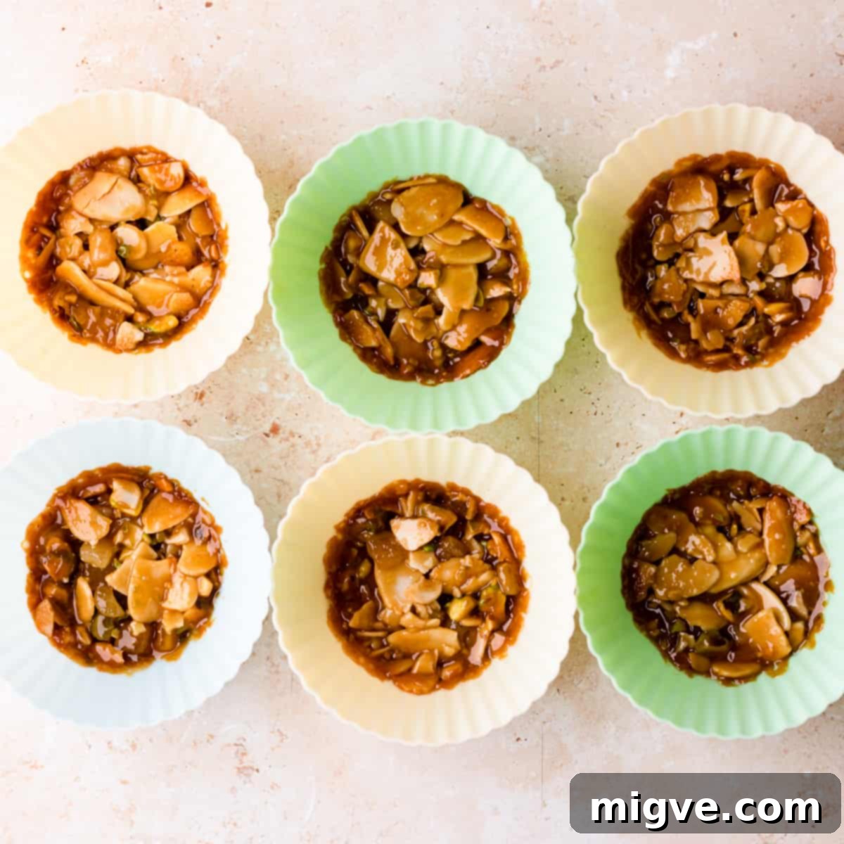 Florentine Almond Lace 14 Almond florentines freshly baked within individual silicone cupcake cases, showing their slightly thicker and chewier form.