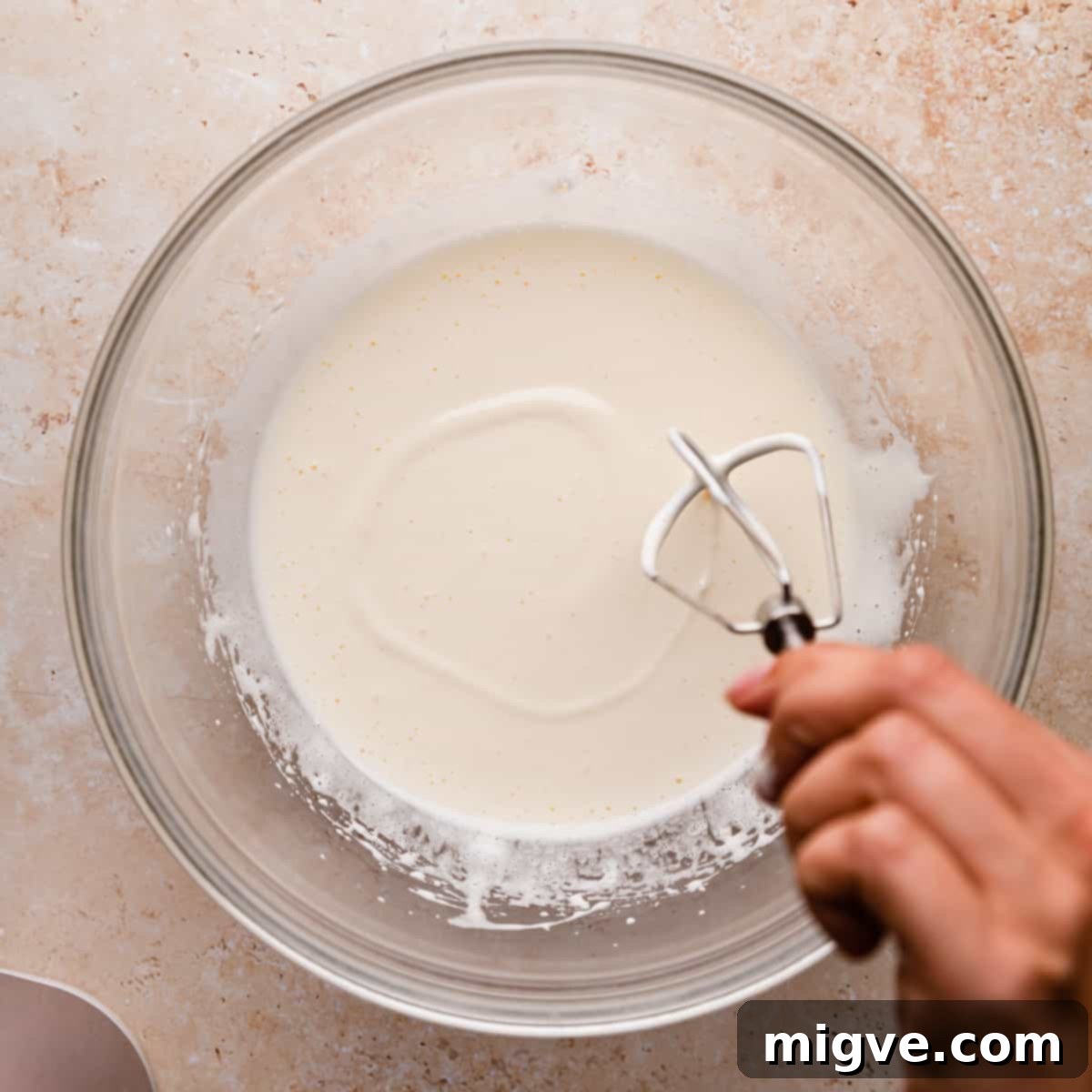 Ruby Red Biscotti 4 whipped egg and sugar mixture inside of glass bowl.