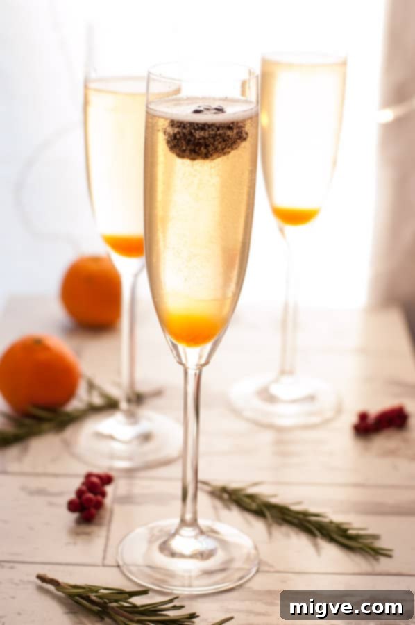 Midnight Breeze Elixir 4 Close-up of a New Year's Breeze Cocktail glass with a fresh rosemary garnish, emphasizing its refreshing qualities.