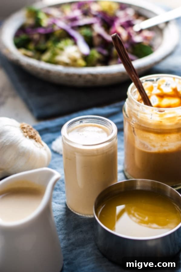 Fresh broccoli salad with red cabbage, raisins, and almonds, drizzled with creamy cashew dressing