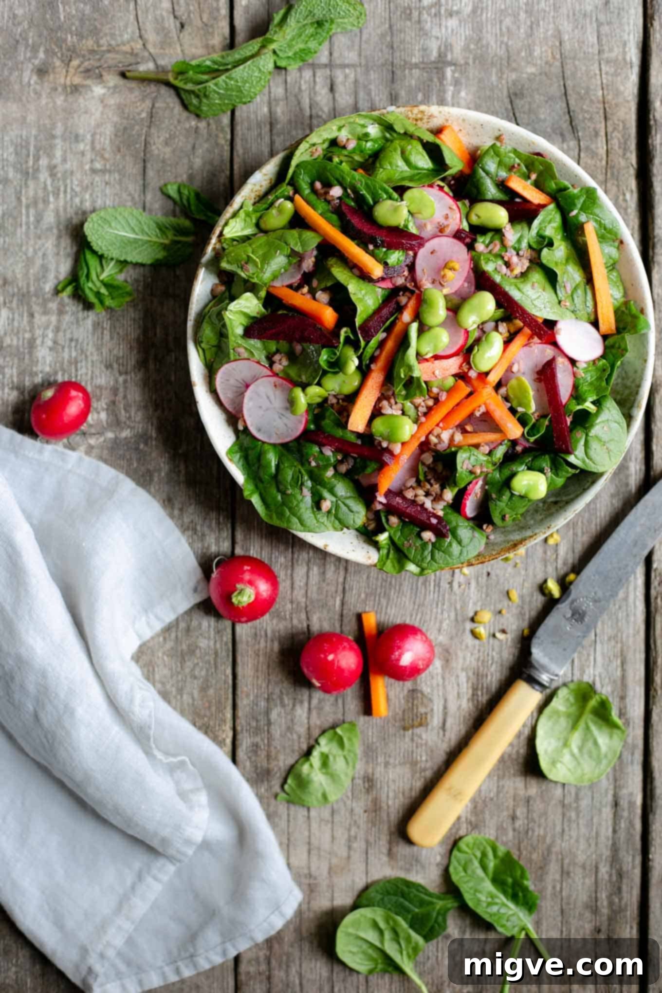 Super clean spinach and beetroot salad, a delicious plant-based and vegan food photography masterpiece, perfect for a healthy lifestyle.