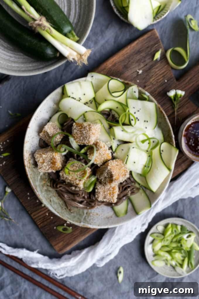 Sticky Tofu coated in sesame seeds, served with delicate soba noodles and a refreshing side of pickled zucchini