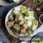Sticky Tofu coated in sesame seeds, served with soba noodles and zucchini